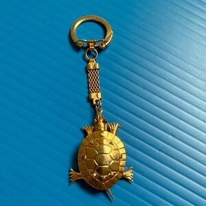 Vintage Gold-tone Articulated Turtle Keychain with Red Eye Accents